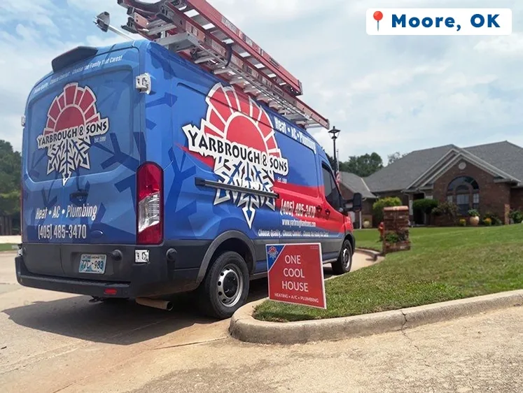 Yarbrough & Sons van parked outside a brick home in Moore, OK, with a red yard sign reading “One Cool House – Heating • A/C • Plumbing.”