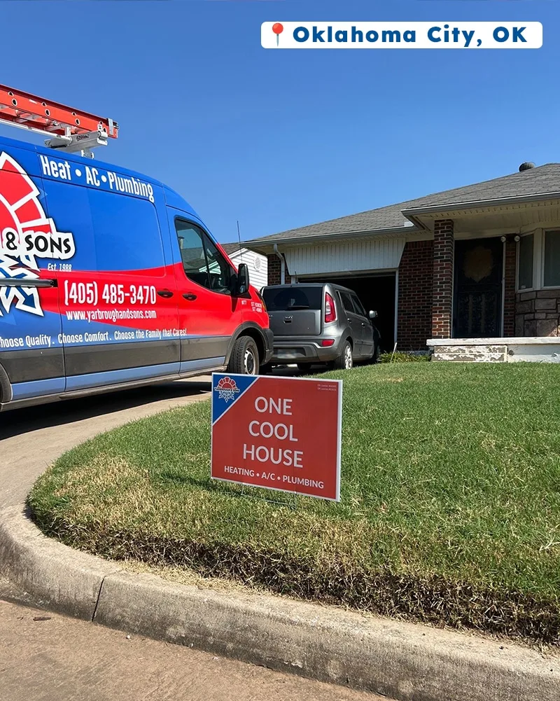 Yarbrough & Sons service van parked in front of a brick home in Oklahoma City, OK, with a “One Cool House” yard sign placed on the lawn.