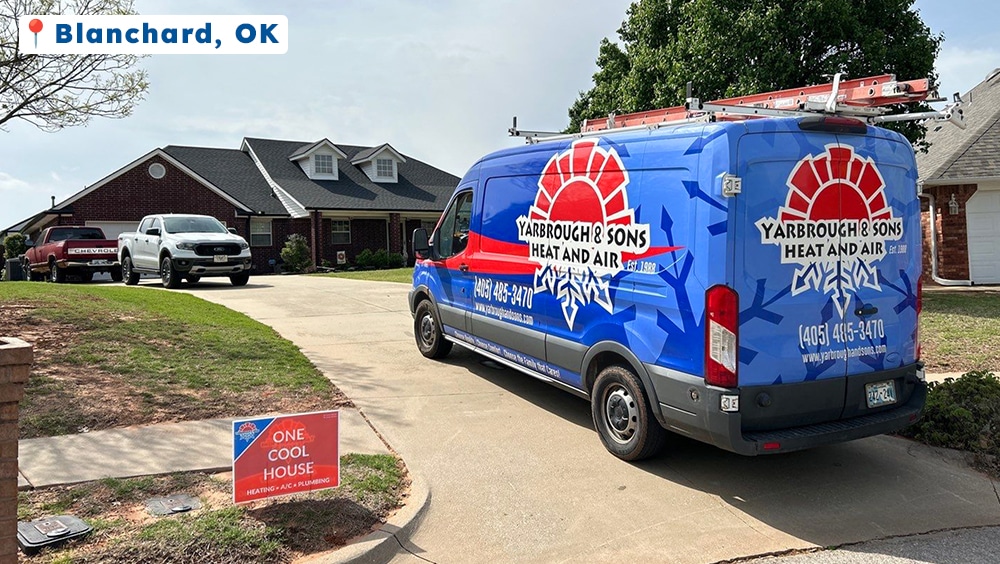 A Yarbrough & Sons service van parked in the driveway of a brick home in Blanchard, OK, with a red and blue “One Cool House” yard sign displayed near the sidewalk.